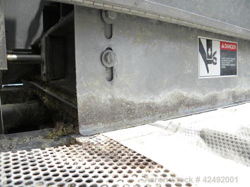 Used Oberlin Automatic Pressure Filter, Model OPF 4 Carbon Steel. 4 Square feet filter area. Approximate press area 24" x 28". End discharge. Cloth advance/roll up each driven by a 1/4 hp, 3/60/208-2...