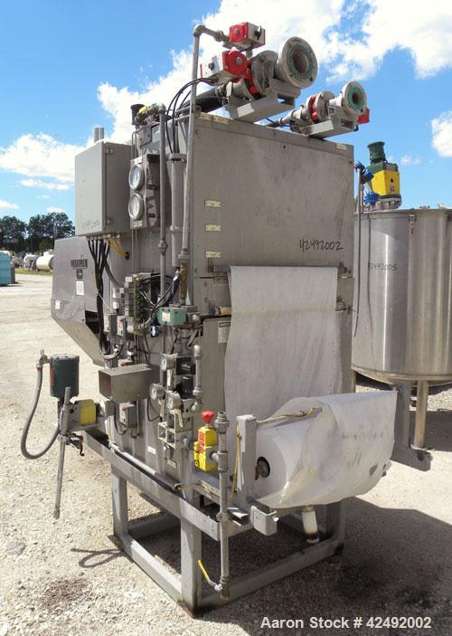 Used Oberlin Automatic Pressure Filter, Model OPF-4, Carbon Steel. 4 Square feet filter area. Approximate press area 24" x 28". End discharge. Cloth advance driven by a 1/4 hp, 3/60/230/460 volt, 114...