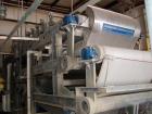 Used Ashbrook Belt Filter Press, Model KLAMPRESS 8/90. 1 Meter wide dewatering belt. Has stainless steel wetted parts and stainless steel screw conveyor. OAL 22'.