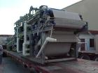 Used Ashbrook Belt Filter Press, Model KLAMPRESS 8/90. 1 Meter wide dewatering belt. Has stainless steel wetted parts and stainless steel screw conveyor. OAL 22'.