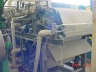 Used Ashbrook Belt Filter Press, Model KLAMPRESS 8/90. 1 Meter wide dewatering belt. Has stainless steel wetted parts and stainless steel screw conveyor. OAL 22'.