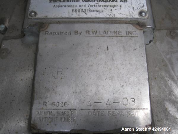 Used 2.6 sq meter ZWAG agitated nutsche filter, stainless steel construction, 1800 liter capacity vessel, rated 2 bar at 100 C internal, jacketed for 6 bar at 100 C, hydraulically operated agitator a...