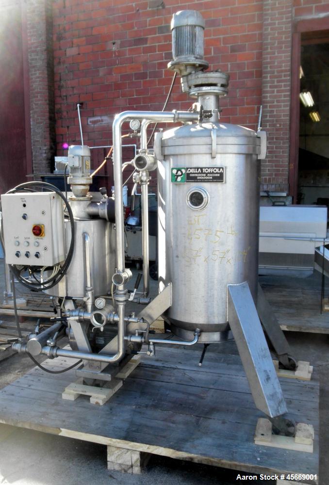 Used Della Toffola 5 square meter DE filter, stainless steel construction, automatically discharged filter. Includes 24" diameter x 40" high vertical tank with rotating horizontal leaves, precoat mix...