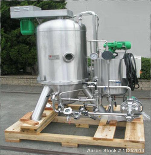 Used Padovan Pressure Leaf Filter, Model G9. Sanitary stainless steel, 8.60 square meter (90 square feet) centrifugal dry cake discharge vertical tank, horizontal leaf pack design with a 3 kW top dri...