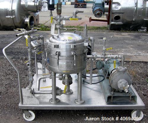 Used Sparkler Horizontal Plate Filter, model 14-D-4, 316 stainless steel. Approximate 3.2 square feet filter area, .38 cubic feet cake capacity, 220 gallons per hour. Vertical jacketed tank 16" diame...