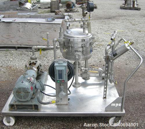 Used Sparkler Horizontal Plate Filter, model 14-D-4, 316 stainless steel. Approximate 3.2 square feet filter area, .38 cubic feet cake capacity, 220 gallons per hour. Vertical jacketed tank 16" diame...