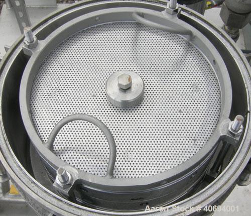 Used Sparkler Horizontal Plate Filter, model 14-D-4, 316 stainless steel. Approximate 3.2 square feet filter area, .38 cubic feet cake capacity, 220 gallons per hour. Vertical jacketed tank 16" diame...
