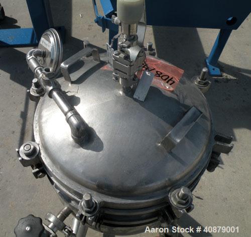 Used Sparkler Horizontal Plate Filter, Model 14-D-4, 316 stainless steel. Approximate 3.52 square feet filter area, .445 cubic feet cake capacity, 220 gallons per hour. Vertical jacketed tank 16" dia...