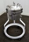 Used Sparkler Filter Horizontal Plate Filter, Model 14-7, 304 Stainless Steel. 6.23 Square feet filter area, 0.229 cubic feet cake capacity. Vertical non-jacketed tank 16