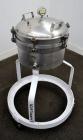 Used Sparkler Filter Horizontal Plate Filter, Model 14-7, 304 Stainless Steel. 6.23 Square feet filter area, 0.229 cubic feet cake capacity. Vertical non-jacketed tank 16