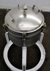 Used Sparkler Filter Horizontal Plate Filter, Model 14-7, 304 Stainless Steel. 6.23 Square feet filter area, 0.229 cubic feet cake capacity. Vertical non-jacketed tank 16