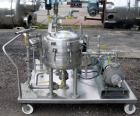 Used Sparkler Horizontal Plate Filter, model 14-D-4, 316 stainless steel. Approximate 3.2 square feet filter area, .38 cubic feet cake capacity, 220 gallons per hour. Vertical jacketed tank 16