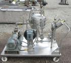 Used Sparkler Horizontal Plate Filter, model 14-D-4, 316 stainless steel. Approximate 3.2 square feet filter area, .38 cubic feet cake capacity, 220 gallons per hour. Vertical jacketed tank 16