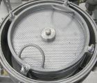 Used Sparkler Horizontal Plate Filter, model 14-D-4, 316 stainless steel. Approximate 3.2 square feet filter area, .38 cubic feet cake capacity, 220 gallons per hour. Vertical jacketed tank 16