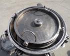 Used Sparkler Horizontal Plate Filter, Model 14-D-4, 316 stainless steel. Approximate 3.52 square feet filter area, .445 cubic feet cake capacity, 220 gallons per hour. Vertical jacketed tank 16