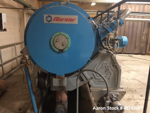 Used Fournier Rotary Press, Model 6-900/6000 CV. 36" wheels, 6 channels. Approximately 7,000 hours run. Weight: 17,130 lbs. Previously used in a waste water application.