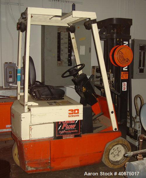 Used Nissan forklift, model 30, battery, with charger.