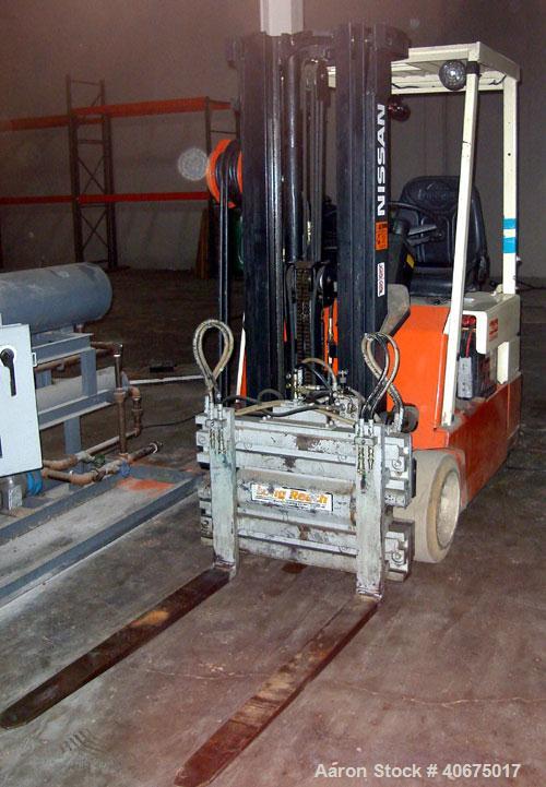 Used Nissan forklift, model 30, battery, with charger.