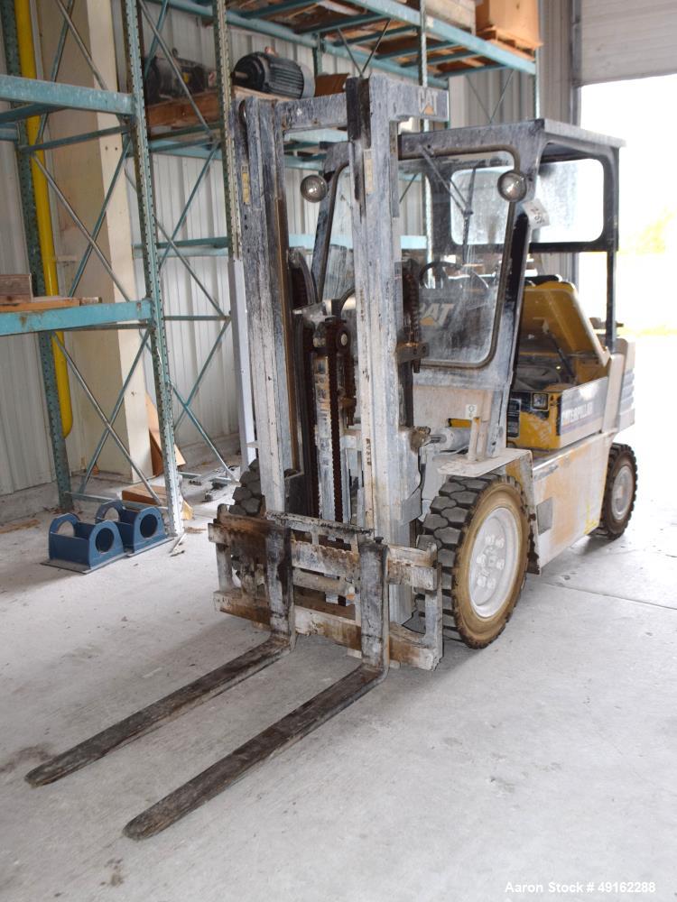Used Caterpillar 5000 Pound Propane Forklift, Model V50E. Solid tires, double mast, approximate 48" long forks. Serial# 4EG00527.