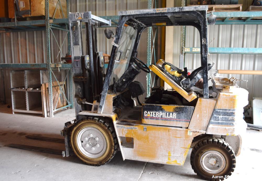 Used Caterpillar 5000 Pound Propane Forklift, Model V50E. Solid tires, double mast, approximate 48" long forks. Serial# 4EG00527.
