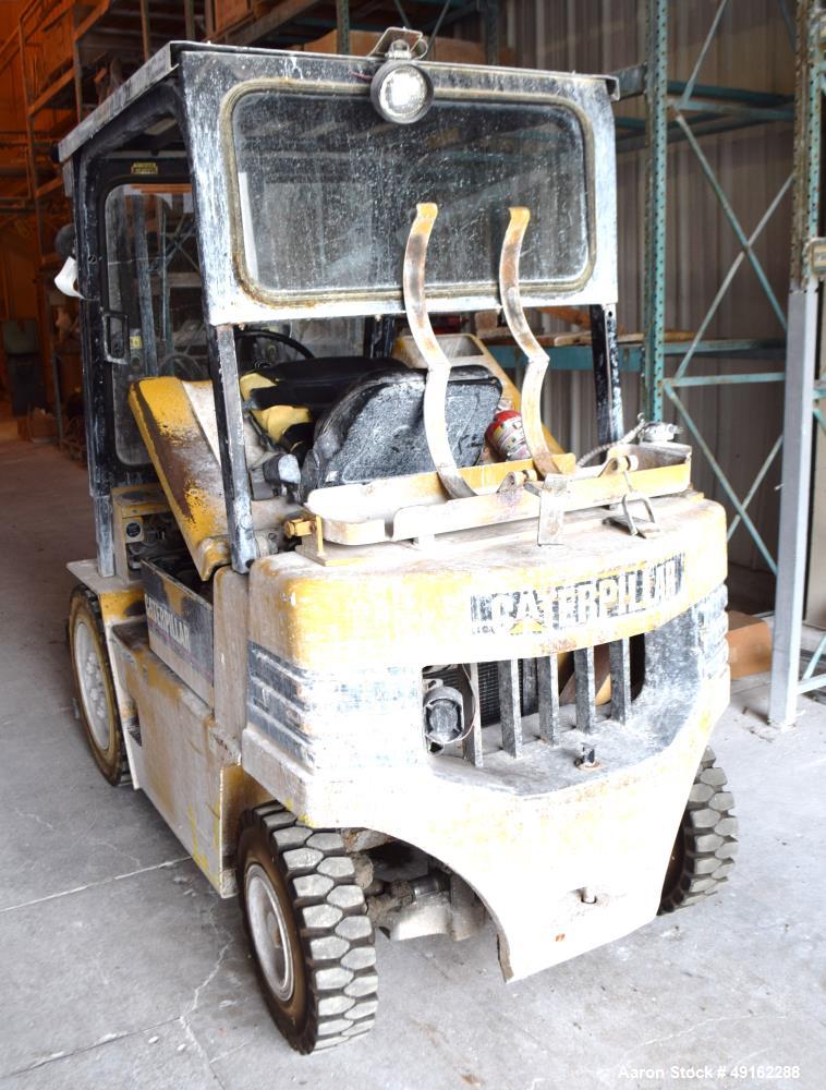 Used Caterpillar 5000 Pound Propane Forklift, Model V50E. Solid tires, double mast, approximate 48" long forks. Serial# 4EG00527.