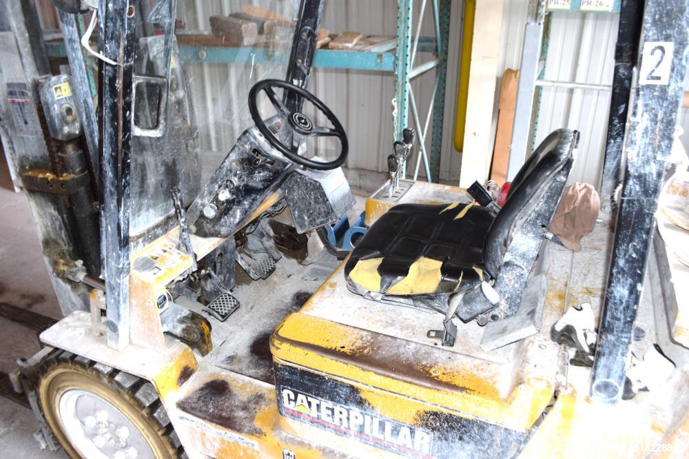 Used Caterpillar 5000 Pound Propane Forklift, Model V50E. Solid tires, double mast, approximate 48" long forks. Serial# 4EG00527.