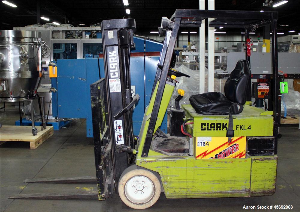 Used Clark Electric Fork Lift/Truck, Model TM15. 9852 Hours. 2575 capacity. 42" long forks. Has side shift. Battery operated.
