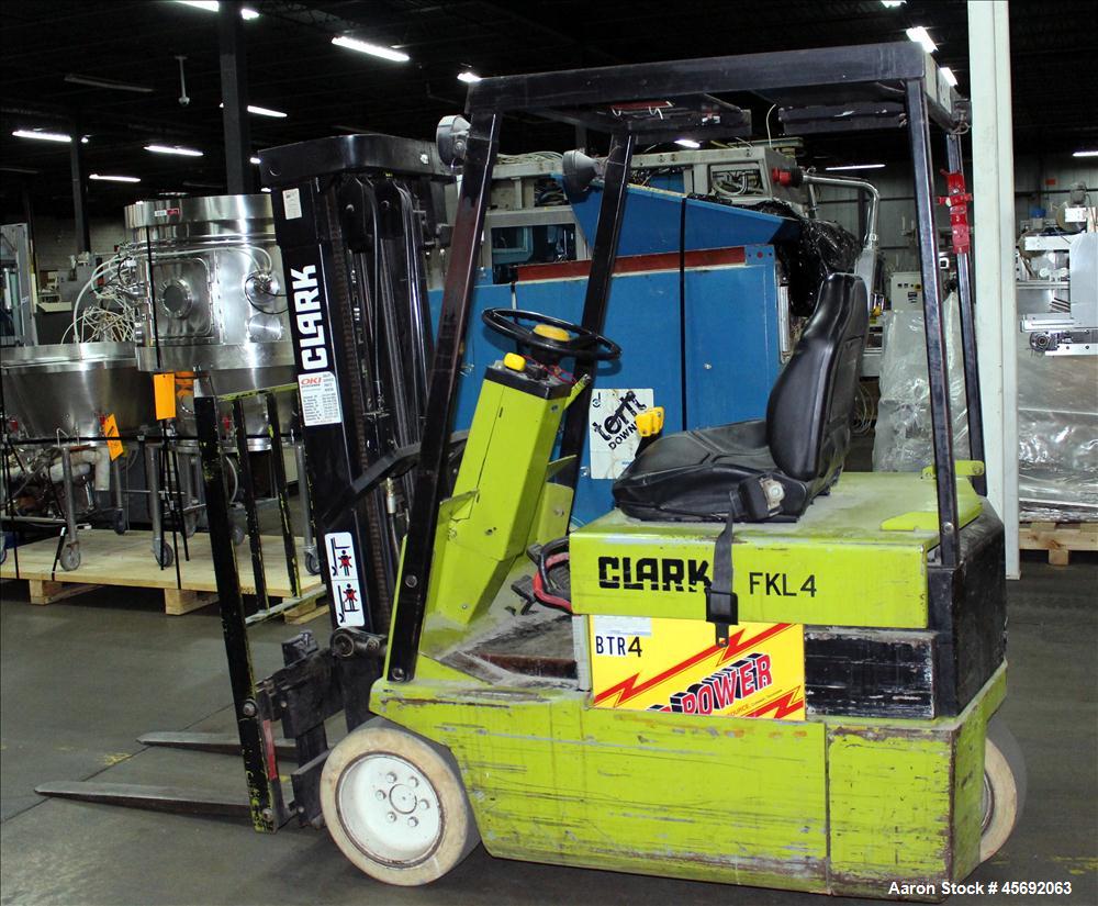 Used Clark Electric Fork Lift/Truck, Model TM15. 9852 Hours. 2575 capacity. 42" long forks. Has side shift. Battery operated.