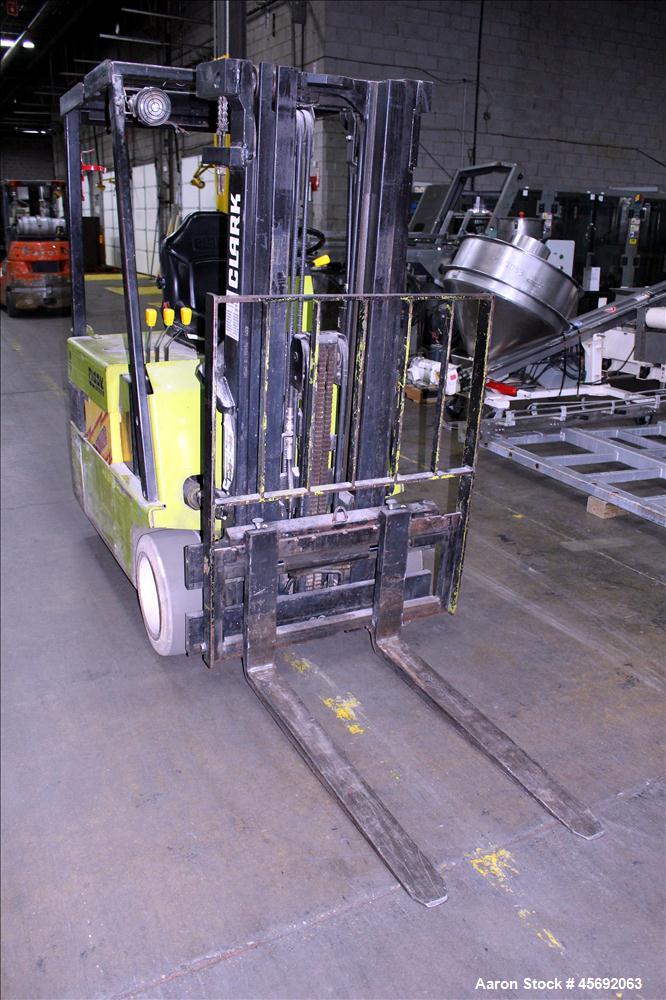 Used Clark Electric Fork Lift/Truck, Model TM15. 9852 Hours. 2575 capacity. 42" long forks. Has side shift. Battery operated.