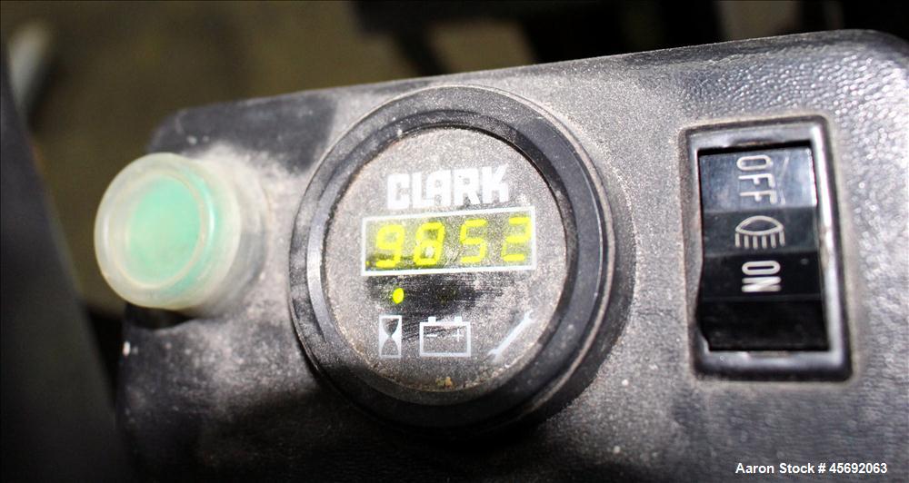 Used Clark Electric Fork Lift/Truck, Model TM15. 9852 Hours. 2575 capacity. 42" long forks. Has side shift. Battery operated.