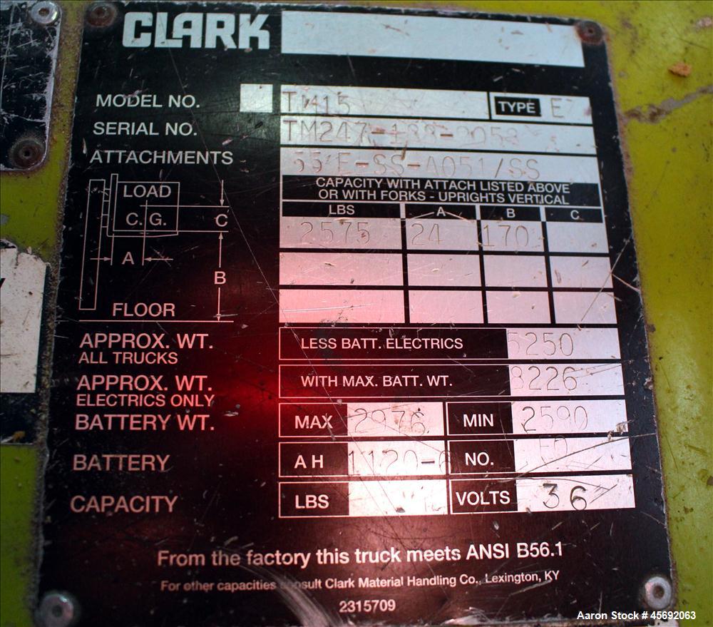 Used Clark Electric Fork Lift/Truck, Model TM15. 9852 Hours. 2575 capacity. 42" long forks. Has side shift. Battery operated.