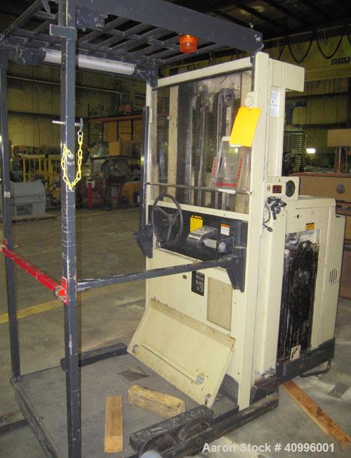 Used Crown Stand Up Electric Order Picker Fork Lift, Model 30SP36TT. 3000 pound capacity. Includes an Exide charger, model NPC12-3-680L.