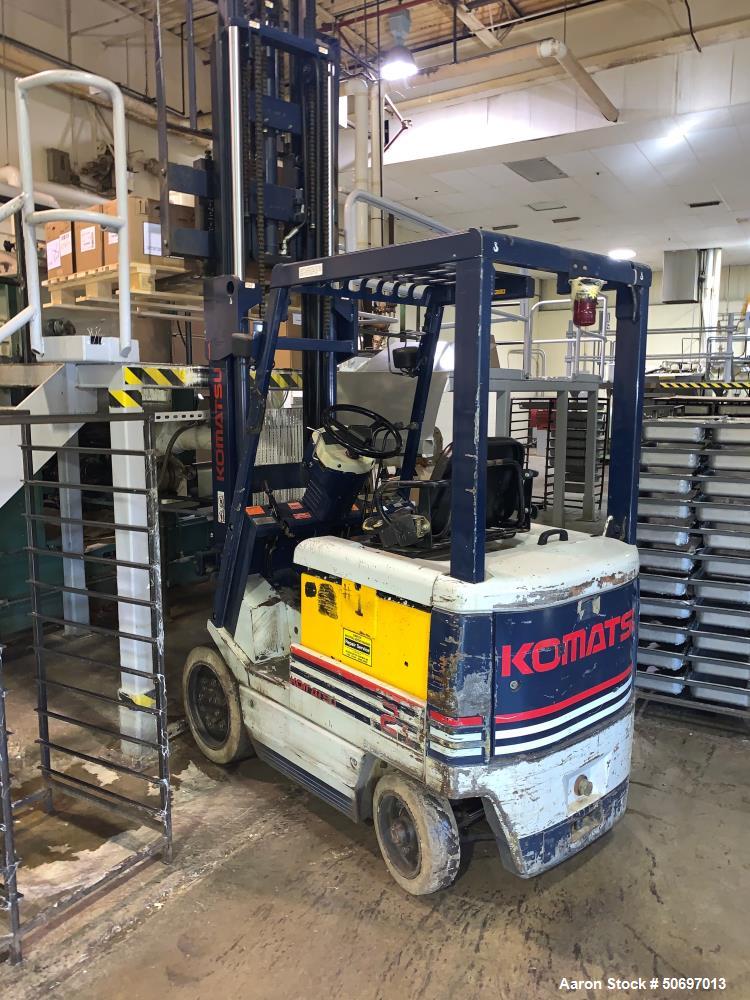 Used Komatsu FB 20SH-4 Counterbalanced, Cushion Tire, 4 Wheel Sit Down Electric Forklift, 3680 lb Load Capacity, Serial # 030001A.  (Reportedly works but battery will not hold charge)