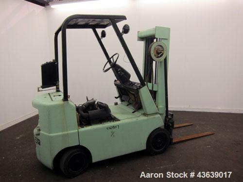 Used Hyster Lift Truck, Model S40F, 4000 Pound Capacity. Double mast, (2) 41-1/2” long  X 4” wide forks. Solid tire, runs on gas. Missing engine cover, and seat.
