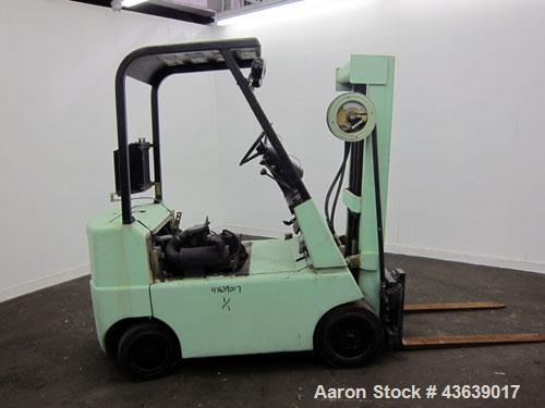 Used Hyster Lift Truck, Model S40F, 4000 Pound Capacity. Double mast, (2) 41-1/2” long  X 4” wide forks. Solid tire, runs on gas. Missing engine cover, and seat.