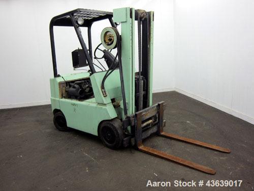 Used Hyster Lift Truck, Model S40F, 4000 Pound Capacity. Double mast, (2) 41-1/2” long  X 4” wide forks. Solid tire, runs on gas. Missing engine cover, and seat.
