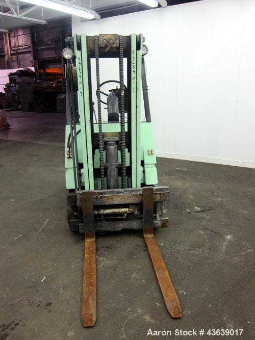 Used Hyster Lift Truck, Model S40F, 4000 Pound Capacity. Double mast, (2) 41-1/2” long  X 4” wide forks. Solid tire, runs on gas. Missing engine cover, and seat.