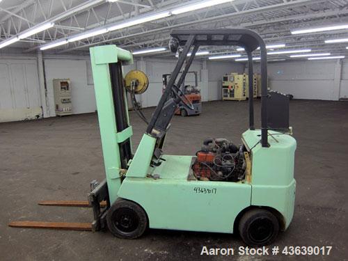 Used Hyster Lift Truck, Model S40F, 4000 Pound Capacity. Double mast, (2) 41-1/2” long  X 4” wide forks. Solid tire, runs on gas. Missing engine cover, and seat.