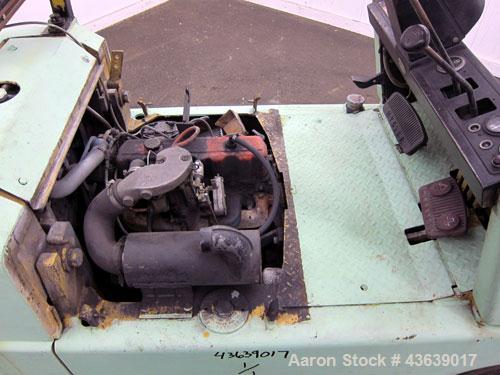 Used Hyster Lift Truck, Model S40F, 4000 Pound Capacity. Double mast, (2) 41-1/2” long  X 4” wide forks. Solid tire, runs on gas. Missing engine cover, and seat.