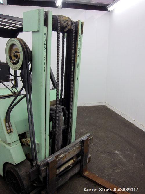 Used Hyster Lift Truck, Model S40F, 4000 Pound Capacity. Double mast, (2) 41-1/2” long  X 4” wide forks. Solid tire, runs on gas. Missing engine cover, and seat.