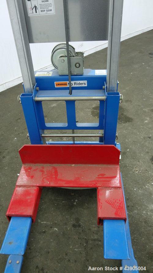 Used Genie GL Lift. 350 Pound lifting capacity. Aluminum and carbon steel frame with casters.	