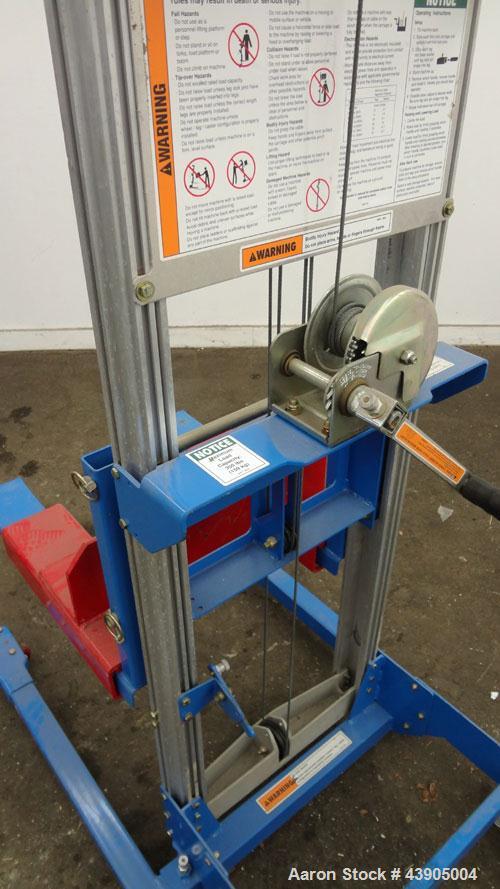 Used Genie GL Lift. 350 Pound lifting capacity. Aluminum and carbon steel frame with casters.	