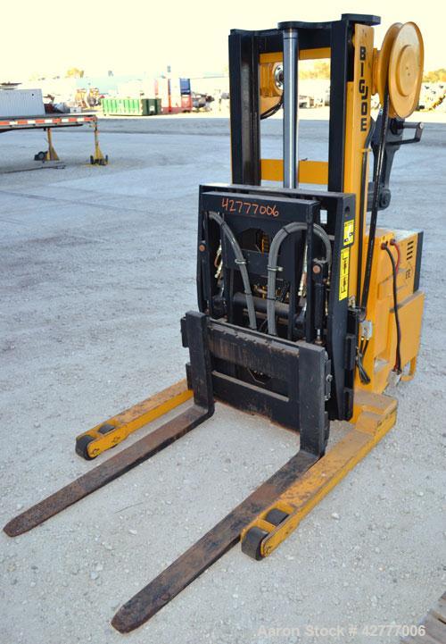 Used Big Joe Electric Walk Behind Reach Truck, Model PDR-20-106. Lifting capacity 2000 pounds at 24’’ center. Lift range 106’’, turning radius from 65’’. Lift speed empty 15’ per minute, loaded 10’ p...