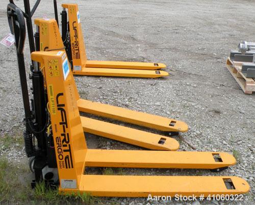 Used Lift-Rite Ergonomic 3000 12 Volt Electric/Manual Portable Scissor Lift, Model RG30E, Carbon Steel. 3000 pound capacity. Fork Width 20.5’’, Fork Length 48’’, Lowered Height 3.25’’, Raised Height ...