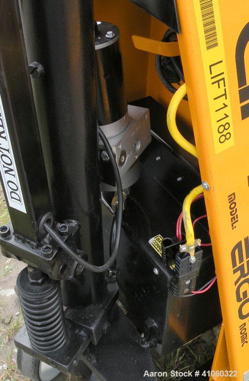 Used Lift-Rite Ergonomic 3000 12 Volt Electric/Manual Portable Scissor Lift, Model RG30E, Carbon Steel. 3000 pound capacity. Fork Width 20.5’’, Fork Length 48’’, Lowered Height 3.25’’, Raised Height ...