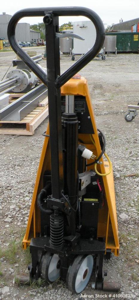 Used Lift-Rite Ergonomic 3000 12 Volt Electric/Manual Portable Scissor Lift, model RG30E, carbon steel. 3000 pound capacity. Fork width 20.5’’, fork length 48’’,lowered height 3.25’’, raised height 3...