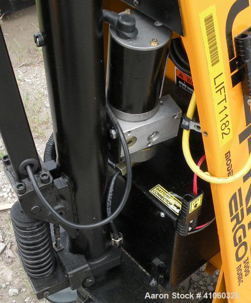 Used Lift-Rite Ergonomic 3000 12 Volt Electric/Manual Portable Scissor Lift, Model RG30E, Carbon Steel. 3000 pound capacity. Fork Width 20.5’’, Fork Length 48’’, Lowered Height 3.25’’, Raised Height ...