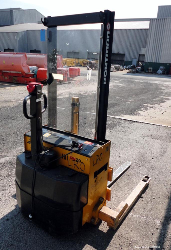 Used- Multition MCI Corp Electric Walk Behind Straddle Stacker, 2000 Pound Capacity, Model SW20-63. Maximum lift height 63”,...