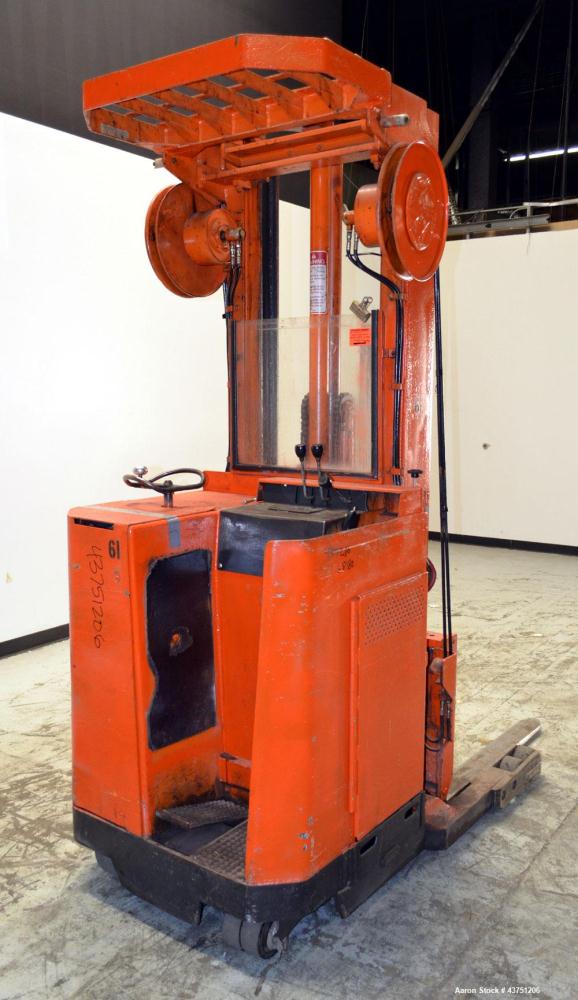 Used Raymond Corporation Stand Up Electric Reach Lift Truck, Model 20-R30TT. 3000 Pound capacity at 190” lift height. (2) Stage mast. Includes a Gould 24 volt battery charger, model GFC-12-900T1. Hou...