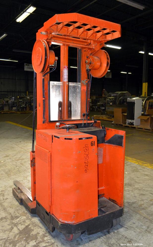 Used Raymond Corporation Stand Up Electric Reach Lift Truck, Model 20-R30TT. 3000 Pound capacity at 190” lift height. (2) Stage mast. Includes a Gould 24 volt battery charger, model GFC-12-900T1. Hou...